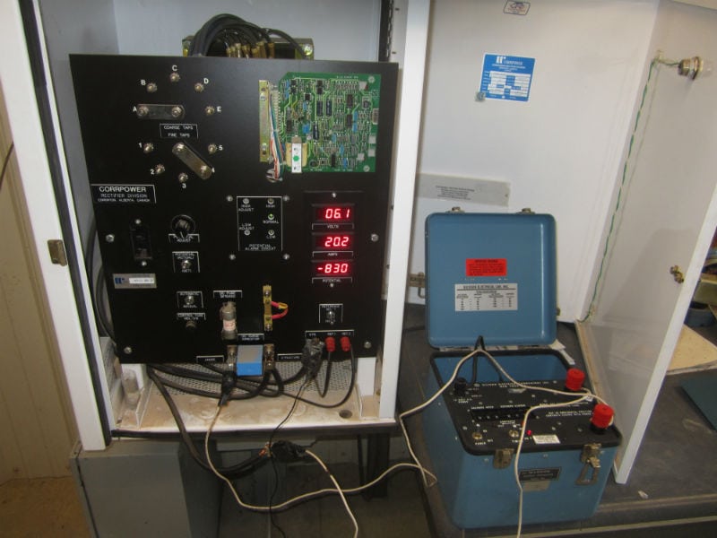 A control panel and some wires on the floor